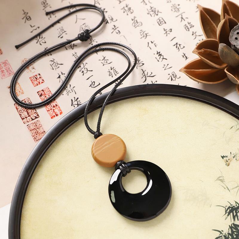 

Natural stone black agate pendant, simple temperament female long necklace, niche high-end sweater chain accessories