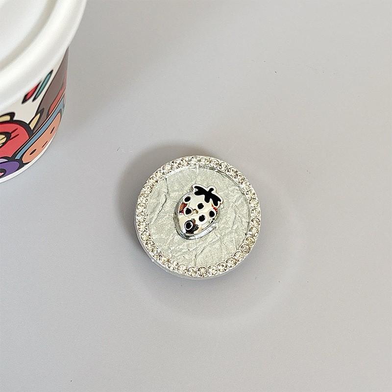 

Electroplated Strawberry Circular Mobile Phone Airbag Holder Adhesive Retractable Folding Desktop Drama Watching Support Wholesale Handle