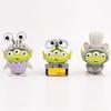 Adorable Three-eyed Alien Figurine In Various Character Costumes Fun Collectible