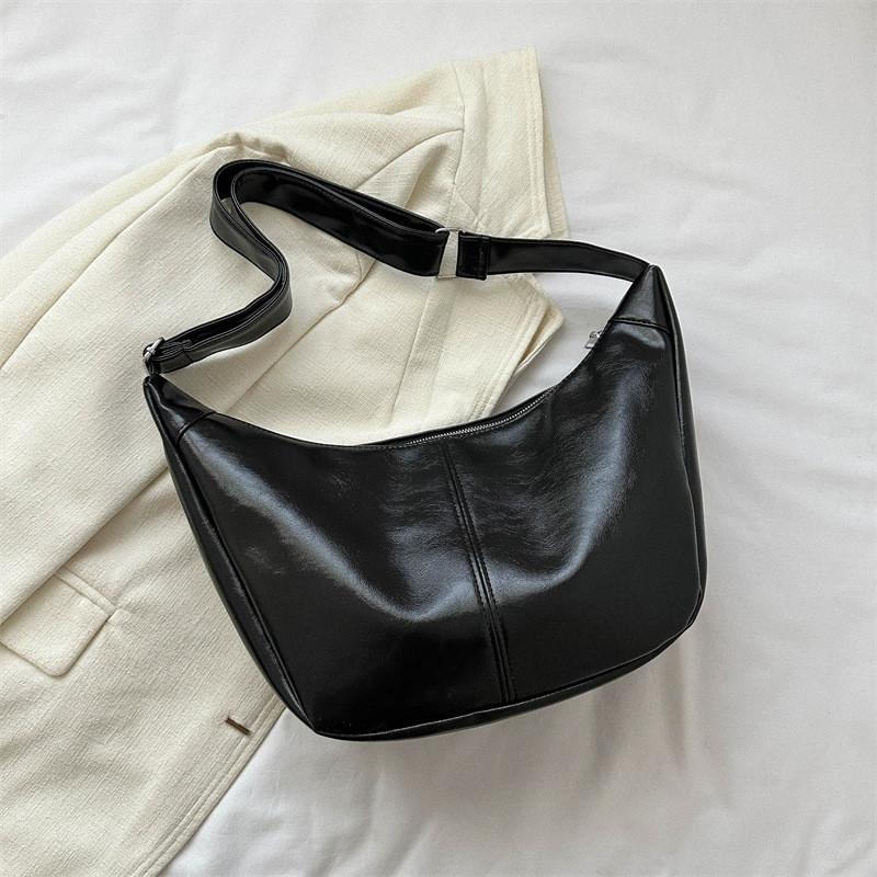 Fashionable Retro Medium Sized Crossbody Bag With Soft Structure And Unique Stitching Details