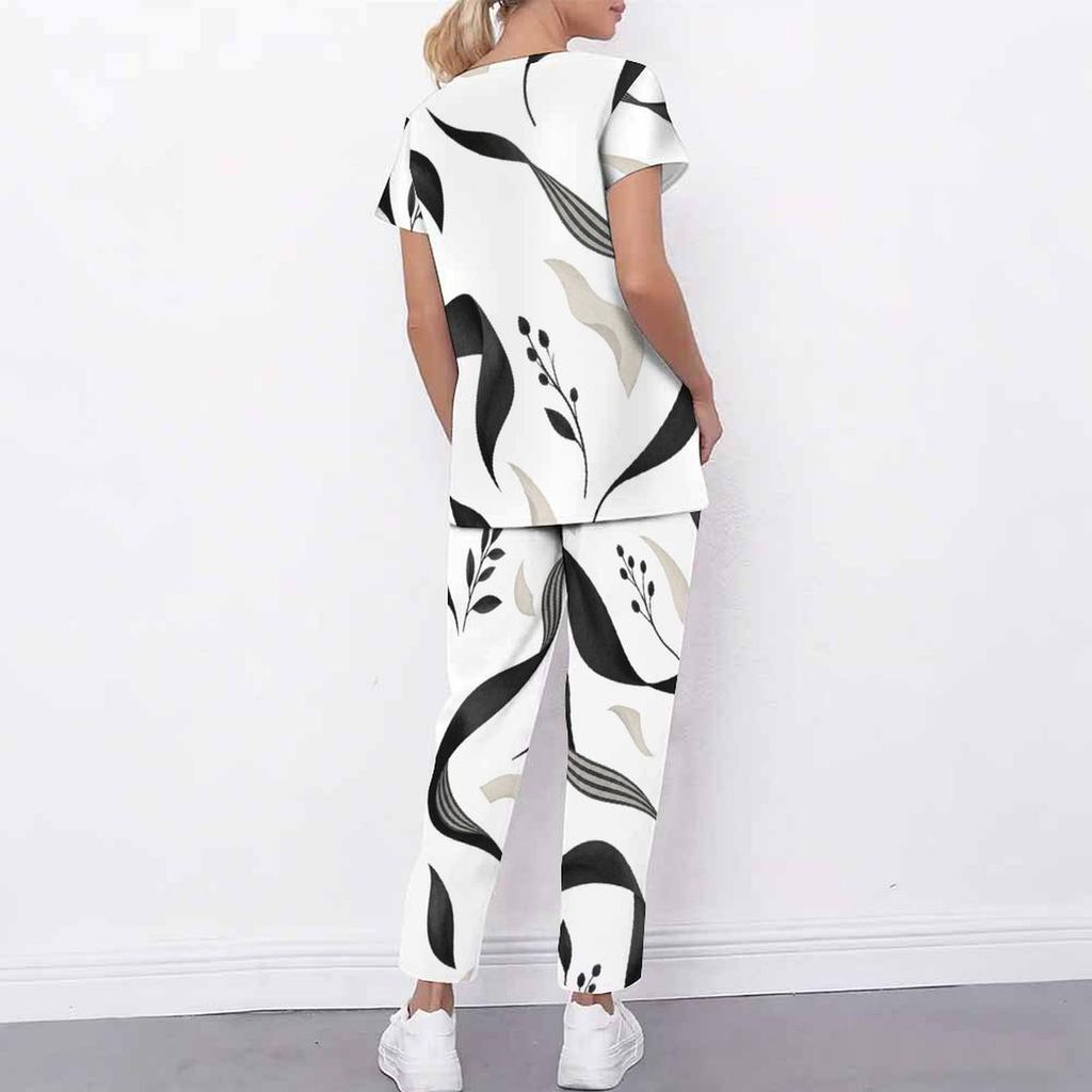 Women Plus Size White Floral Printed Scrub Set Crisscross Cutout Neck Short Sleeve Top With Pockets Long Pants Two Piece