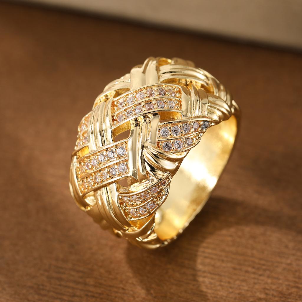 Retro woven and set with artificial gemstones ring made of copper. Women's jewelry ring suitable for formal events.