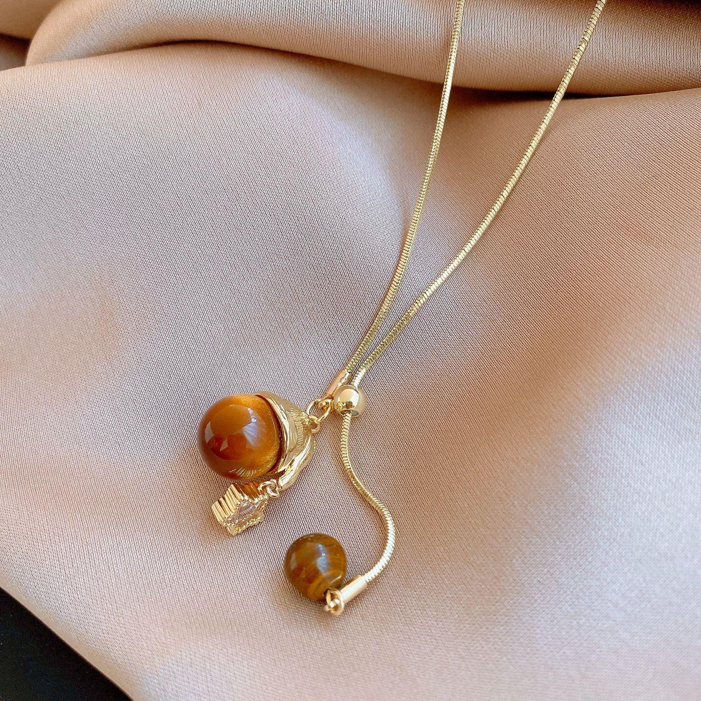 

Star coffee color tiger s eye stone pendant can be pulled necklace niche simple and versatile sweater chain necklace