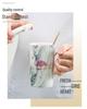 Elegant Marble Pattern Mug with Gold Trim, Spoon Lid, and Custom Logo - Ideal for Coffee or as a Souvenir Gift.