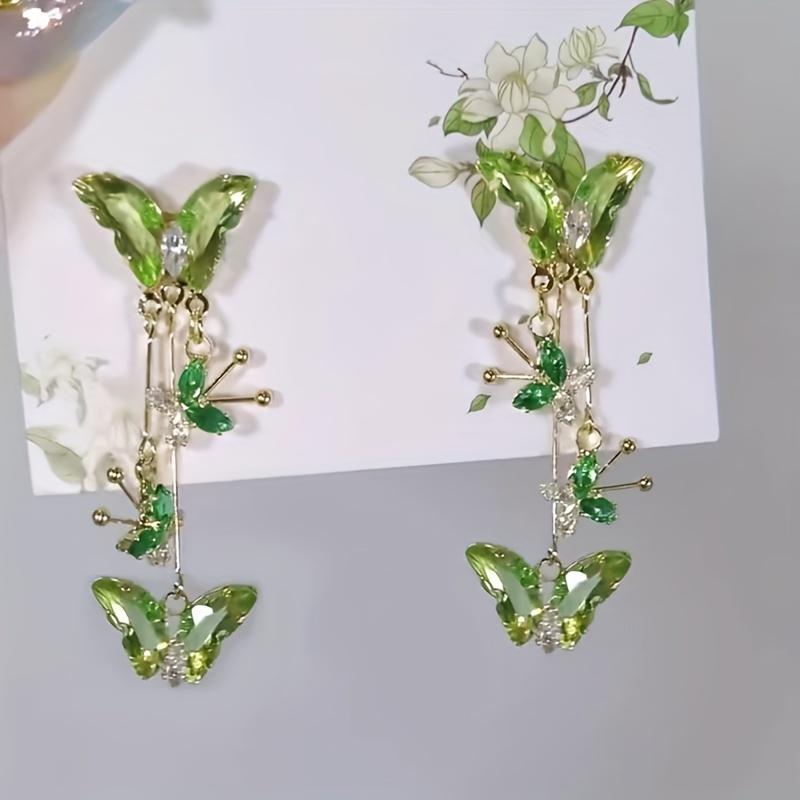 

Пара вишуканих сережок-метеликів для жінок із китицями із цирконію. зелений