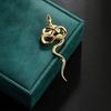 Unique Gold Snake Brooch Symbolizing Strength and Elegant Fashionable Accessory for Parties or Business Meetings