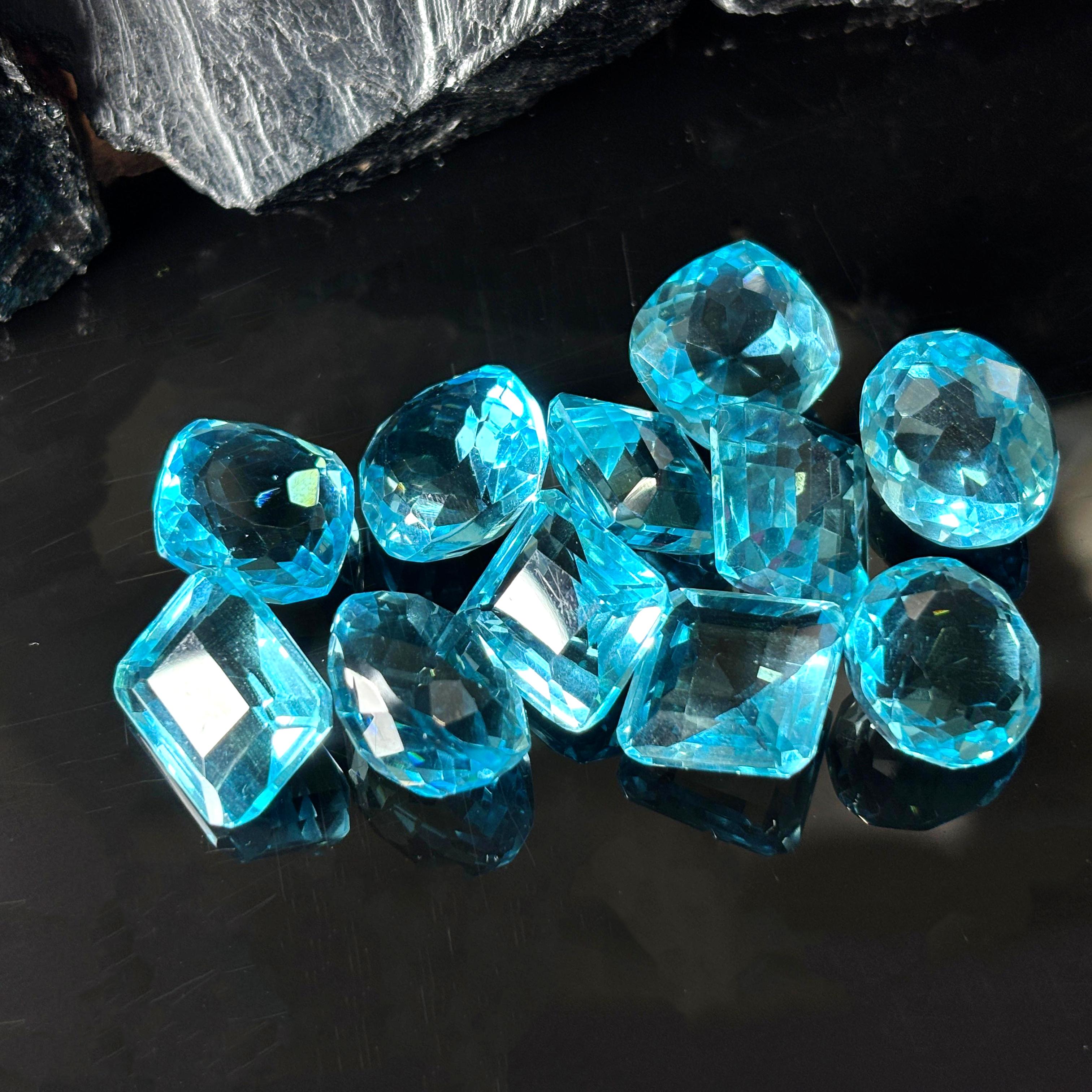 

Mix Cut 50.10 Ct Natural Blue Aquamarine CERTIFIED Loose Gemstone Lot Ring Size AU-15845345 002 13.8 mm approx синій