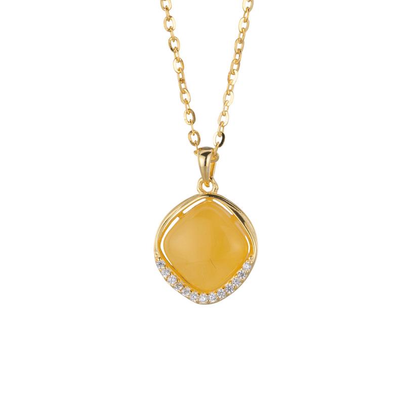 Amber Pendant Necklace with S925 Silver - Retro Water Drop Design with Light Luxury Gemstone.