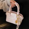 Korean Version of the New Casual Temperament Cute Embossed Portable Bucket Bag High-end Commuter Niche Design Messenger Bag Women