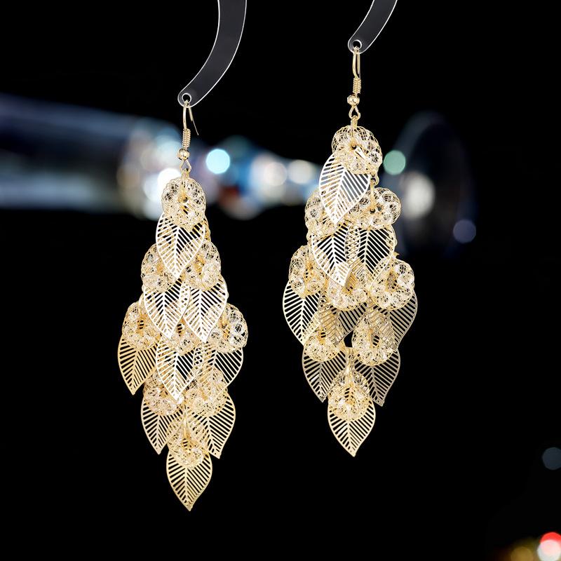 

Серьги Temperament, модное и универсальное, преувеличенно атмосферное платье с длинными серьгами в виде полых листьев дерева с бахромой золотой