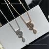 Elegant Gold Rhinestone Tassel Earrings with Geometric Number 5 and Water Drop Clavicle Chain Design