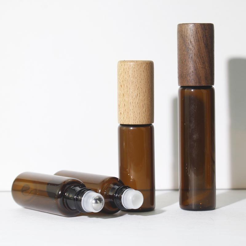 10Pcs 5ml 10ml 15ml Amber Clear Glass Roll On Bottles Natural Bamboo Wood Cap Sample Roller Ball Vials For Essential Oil Perfume