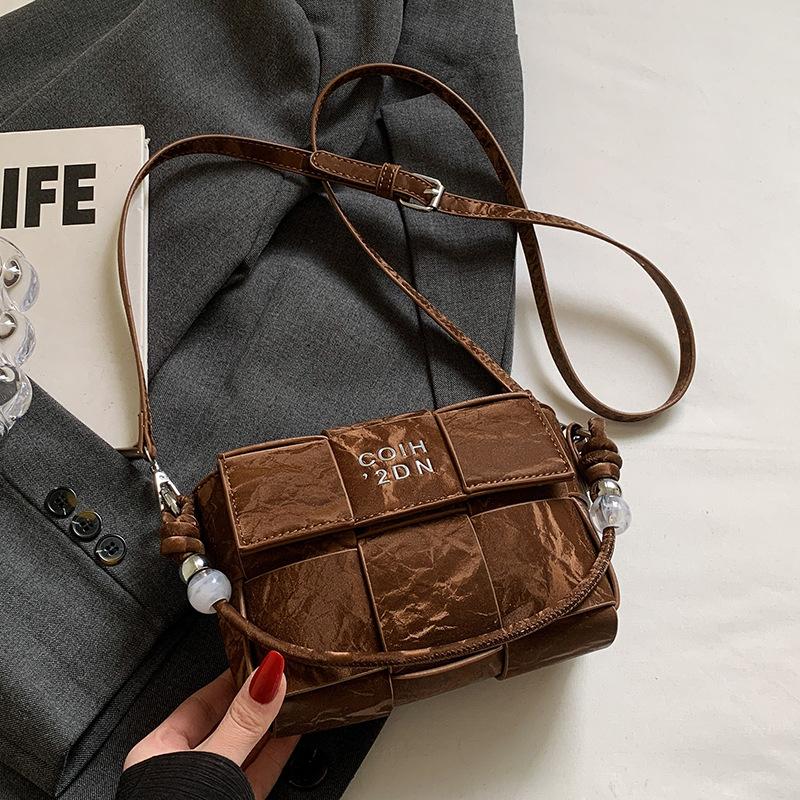 Spring and summer hot sale versatile high-end woven grid portable small square bag Korean version casual fashion commuter messenger women's bag