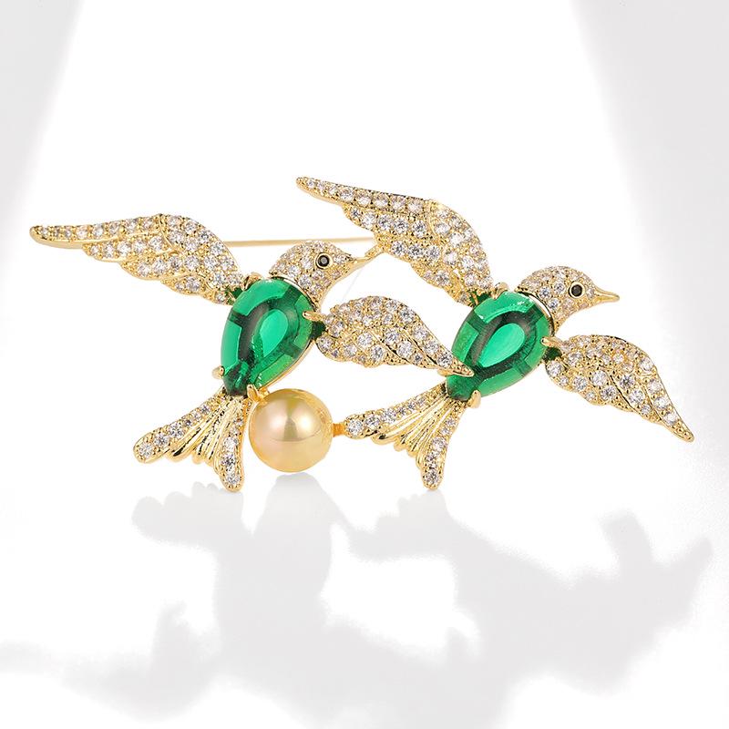 

Dilly Snow Green Chalcedony & Freshwater Pearl Lovebird Brooch with Zircon Accents.