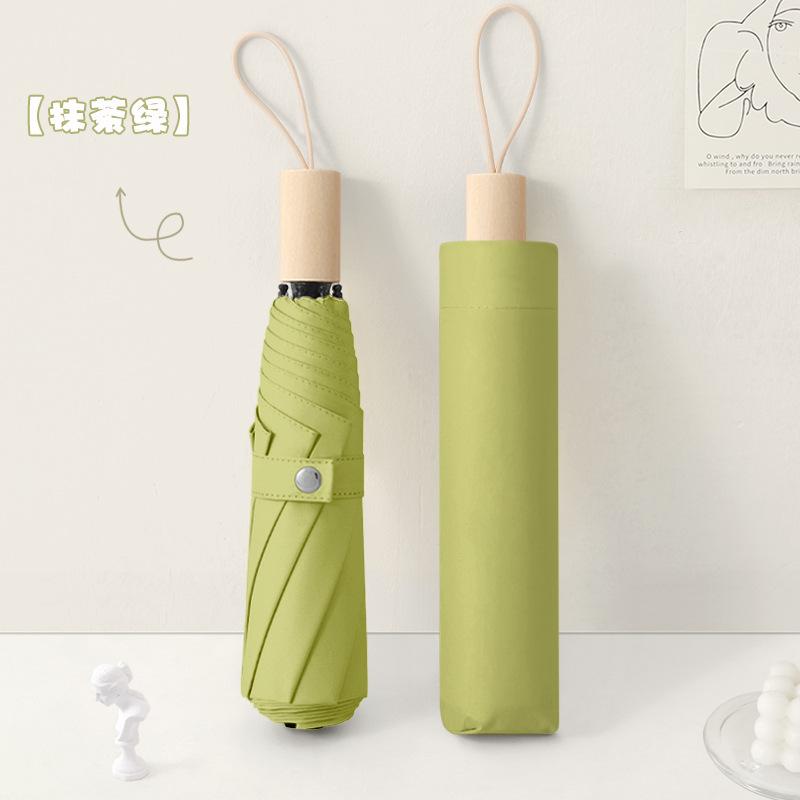 New three-fold simple plain color windproof and sun protection creative solid wood handle female vinyl parasol