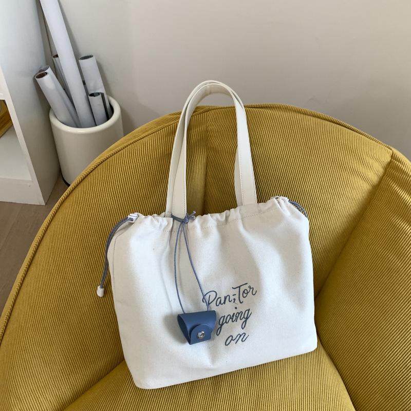 

Canvas bag women s large-capacity new summer versatile casual shoulder drawstring bag college student tote bag білий