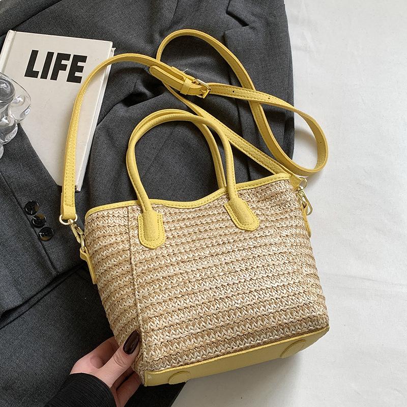 2025 New Niche Design Contrasting Colors Straw Hand-held Bucket Bag Leisure Commuting Vacation Wind Messenger Beach Bag Women