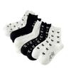 Chaussettes mi-mollet pour femmes, Chaussettes en dentelle pour femmes automne et hiver, Chaussettes en coton polyvalentes à nœud, Chaussettes hautes noires et blanches à bordure oreille