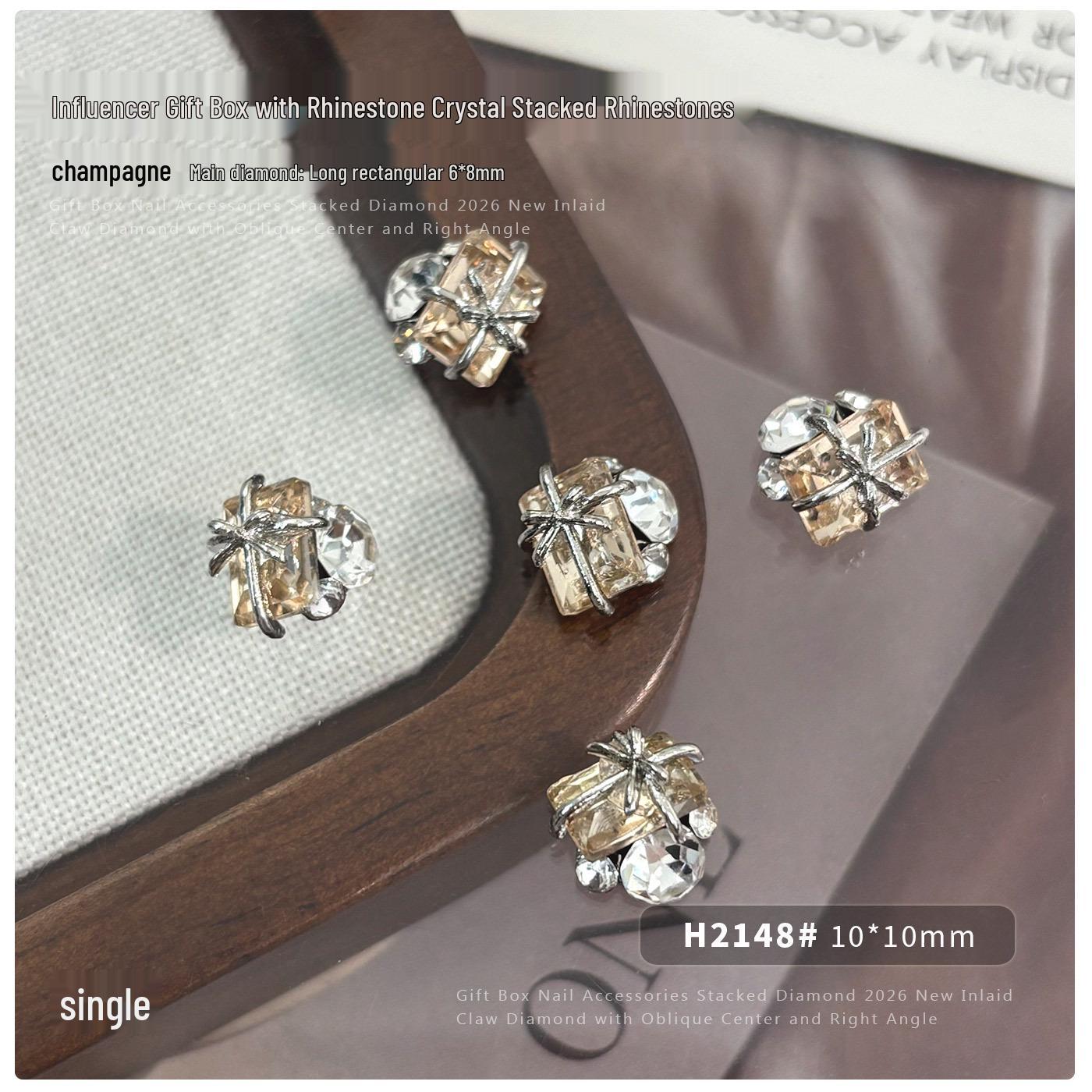 Champagne Gold Rhinestone & Butterfly Nail Art Decorations with Crooked Peach Heart & Right-Angle Diamond Accents.