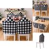 Cozy Black And White Checkered Christmas Chair Slipcover With Stylish Pom Poms For Atmosphere Holiday