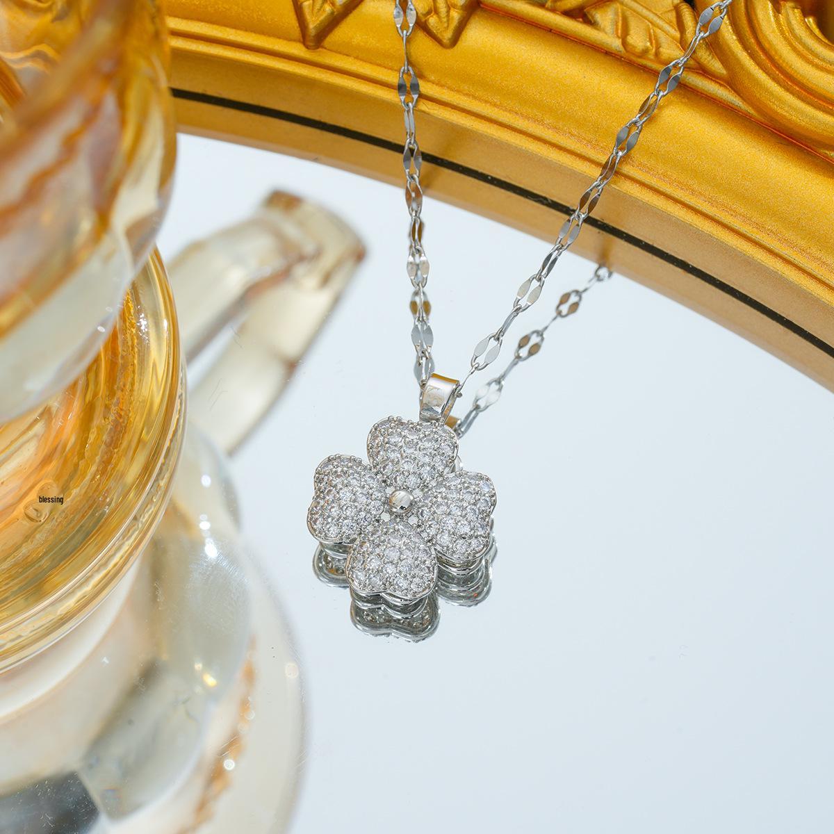 

Titanium Steel Cat s Eye Stone Necklace - Four-Leaf Clover Rotating Jewelry, High-End, Fade-Resistant.