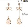 1 Paar Einfache Vielseitige Kleine Frische Schleife Katzenauge Quaste Ohrringe Hipster Langes Temperament Damenschmuck Accessoires