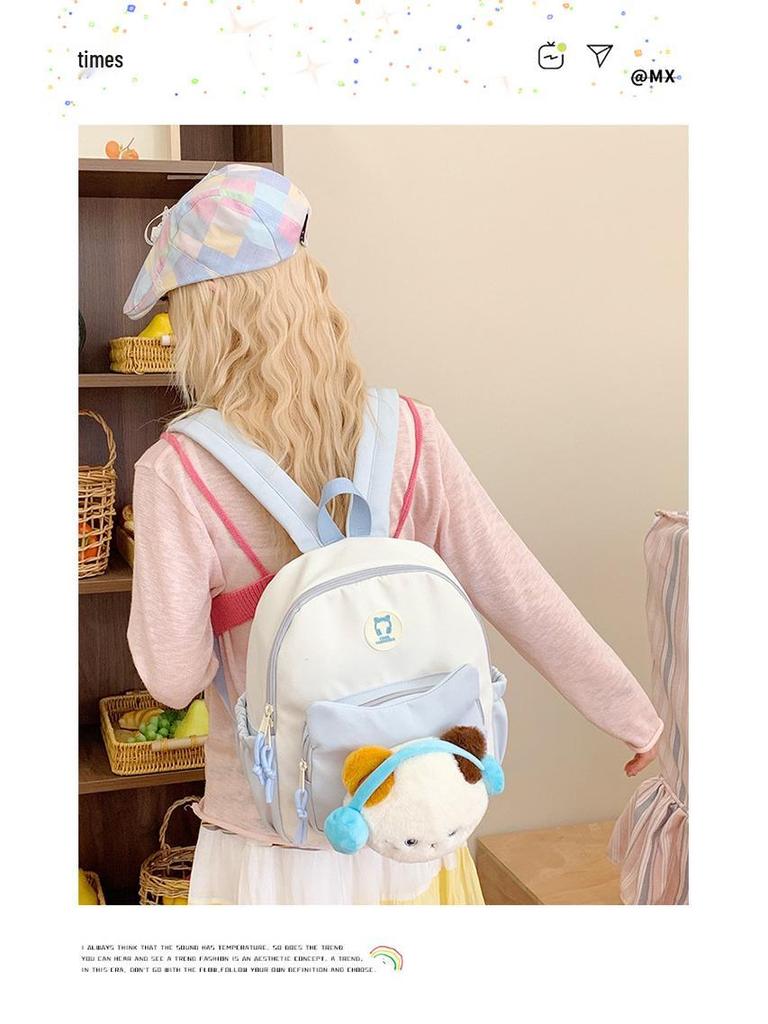 Cute Cartoon Trendy Backpack: Large Capacity, Lightweight, Versatile Travel/School Bag with Earphone and Doll Holder.