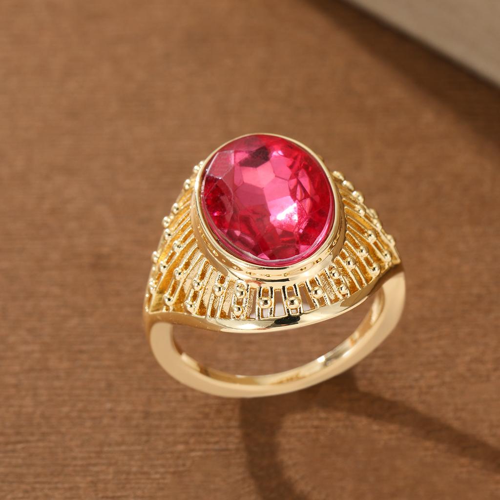 Vintage Hollow Copper Ring with Oval Red Artificial Gem for Women, Suitable for Banquets and Formal Occasions.
