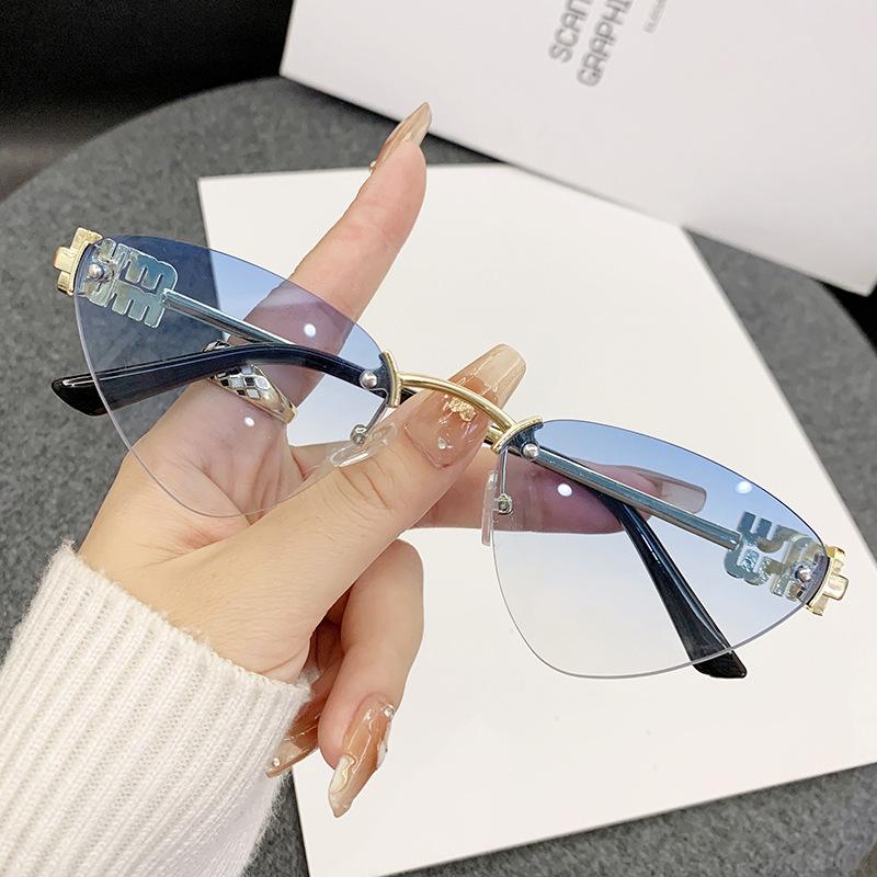 Miao's Frameless Cat-Eye Sunglasses: Women's High-End European & American Style with Hollow Letter Design.