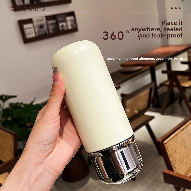 Miniature compact insulated cup with magnetic lid for making tea. Portable outdoor sports insulated drinking water bottle.