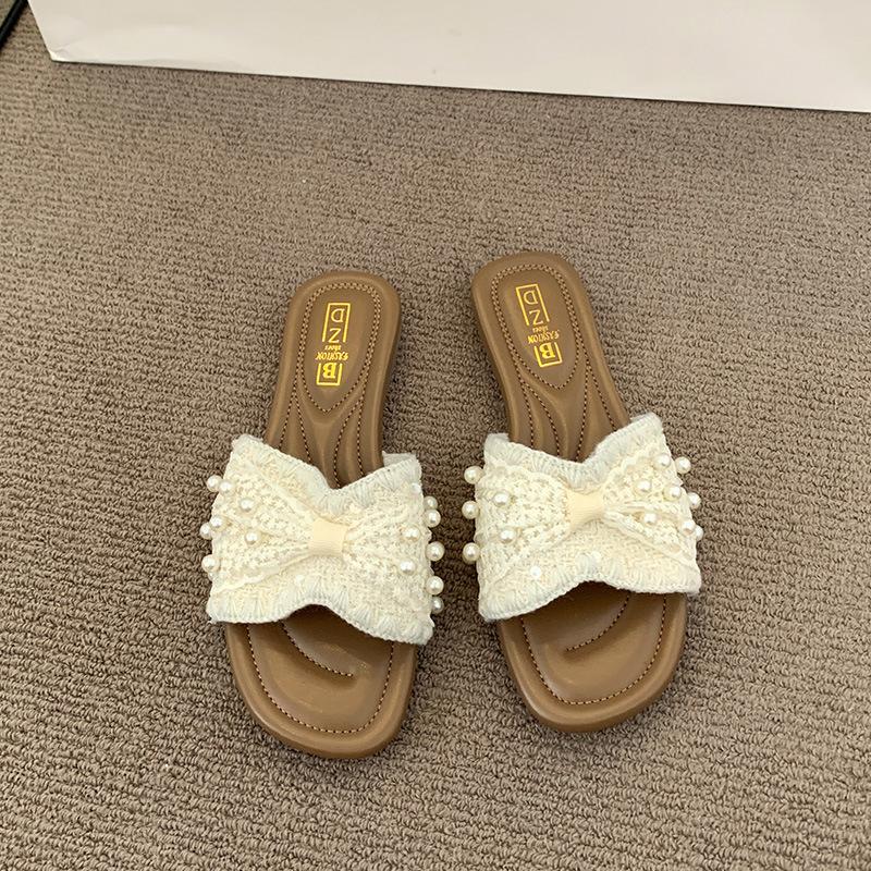French small fragrant pearl slippers women's summer wear 2025 new fashion and leisure one-word flat-bottomed beach cool slippers