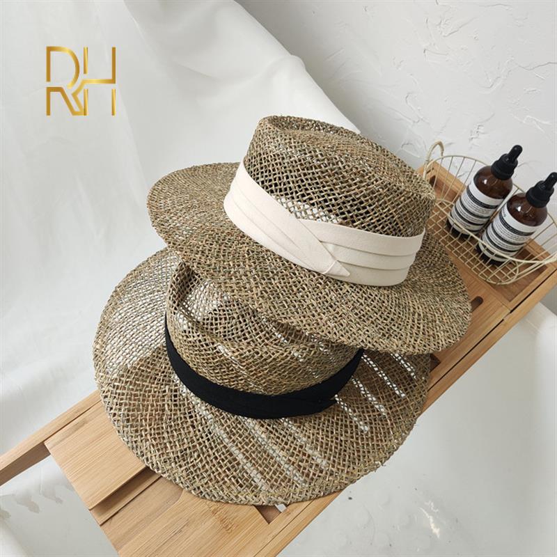 Travel Natural seagrass hollow flat brim hat ladies summer porkpie concave round sun hat beach straw hat with ribbon sale