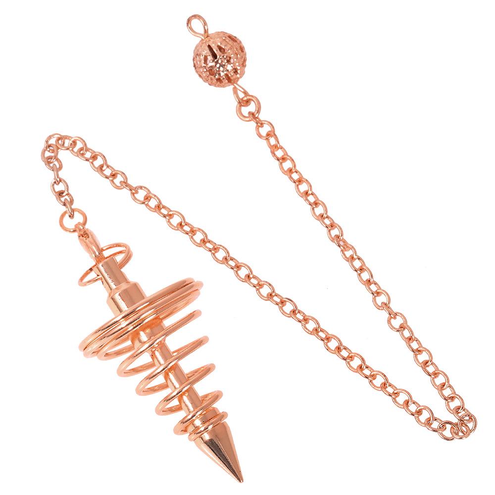 

Vintage spiral metal pendulum, a divination tool with a chain, used for meditation and divination. рожевий колір золота
