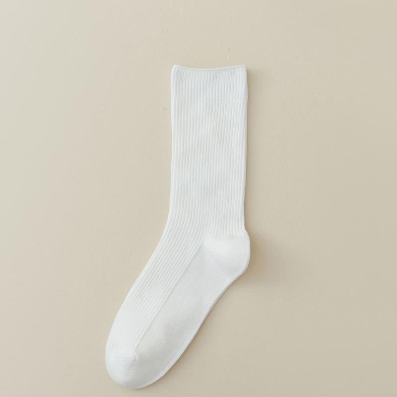 For Women, There Are Boneless and Non-uncomfortable Mid-calf Socks. Pull A Solid-colored Cotton Long Calf Sock That Is Breathable