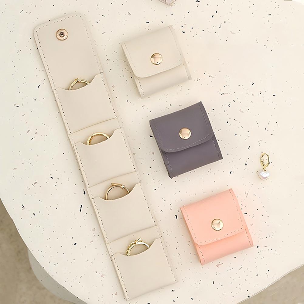 Compact Travel Jewelry Organizer Bag with Secure Button Closure Separate Compartments for Rings Earrings Necklaces