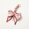 Elegant Hand-Woven Scarf Chain with Bow Decoration Pendant for Bag Strap Modification.