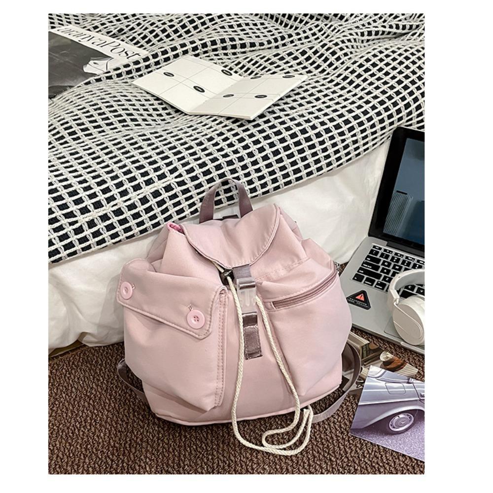 

Korean niche pocket button drawstring backpack star flat with the same nylon backpack outdoor leisure 28*12*28