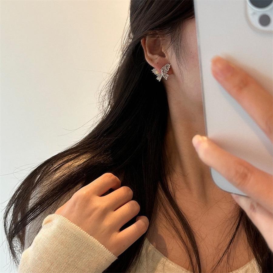 Tang grass pattern hollow butterfly stud earrings 925 silver niche design high-end earrings light luxury versatile earrings