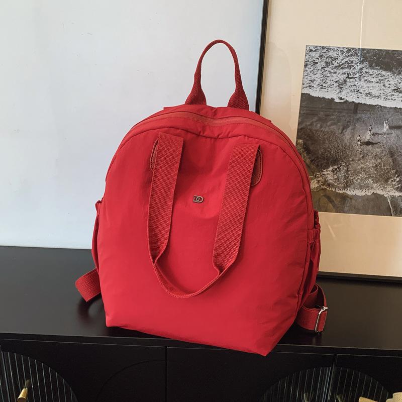 

Летняя новая большая вместимость Макарон водонепроницаемая тканевая сумка женский рюкзак рюкзак дорожная сумка красный