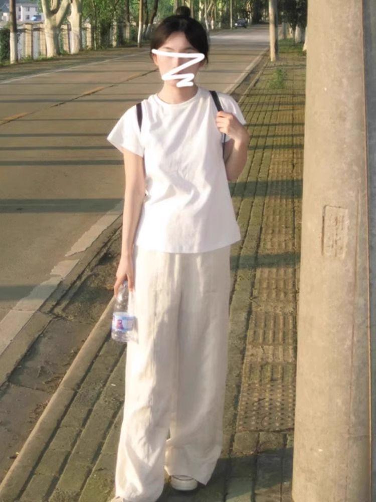 

Женская белая футболка с коротким рукавом, круглым вырезом, приталенного кроя - Коллекция Лето 2025 Large белый