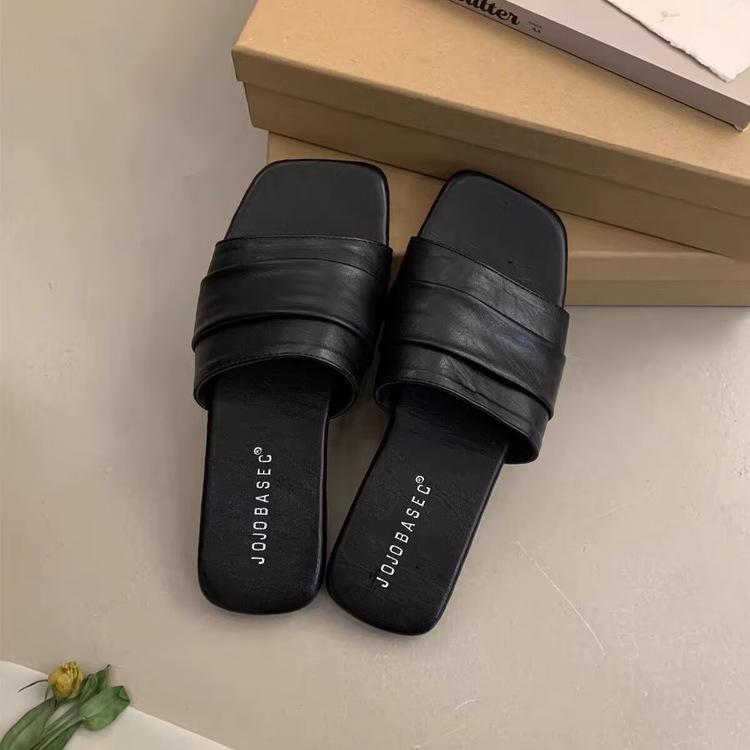 

Flat-bottomed slippers women s outer wear summer new retro niche one-word drag pleated soft leather seaside vacation beach sandals 35