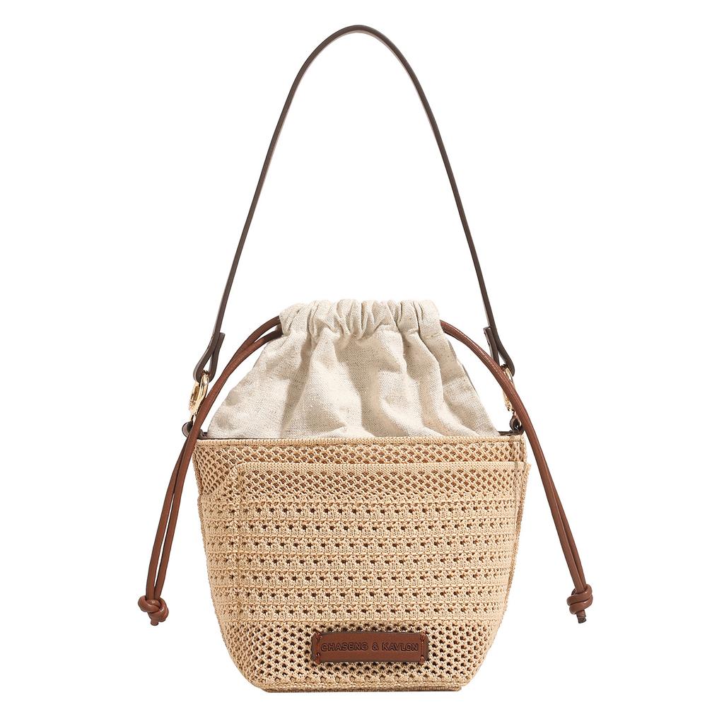 Drawstring bucket bag 2025 summer new casual vacation woven beach bag niche texture versatile shoulder crossbody bag