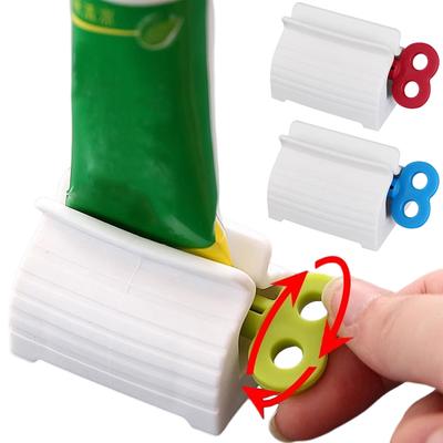 Mini stláčač zubnej pasty Ručný držiak dávkovača stláčacej trubičky Multifunkčný kúpeľňový nástroj na čistenie zubnej pasty na tvár