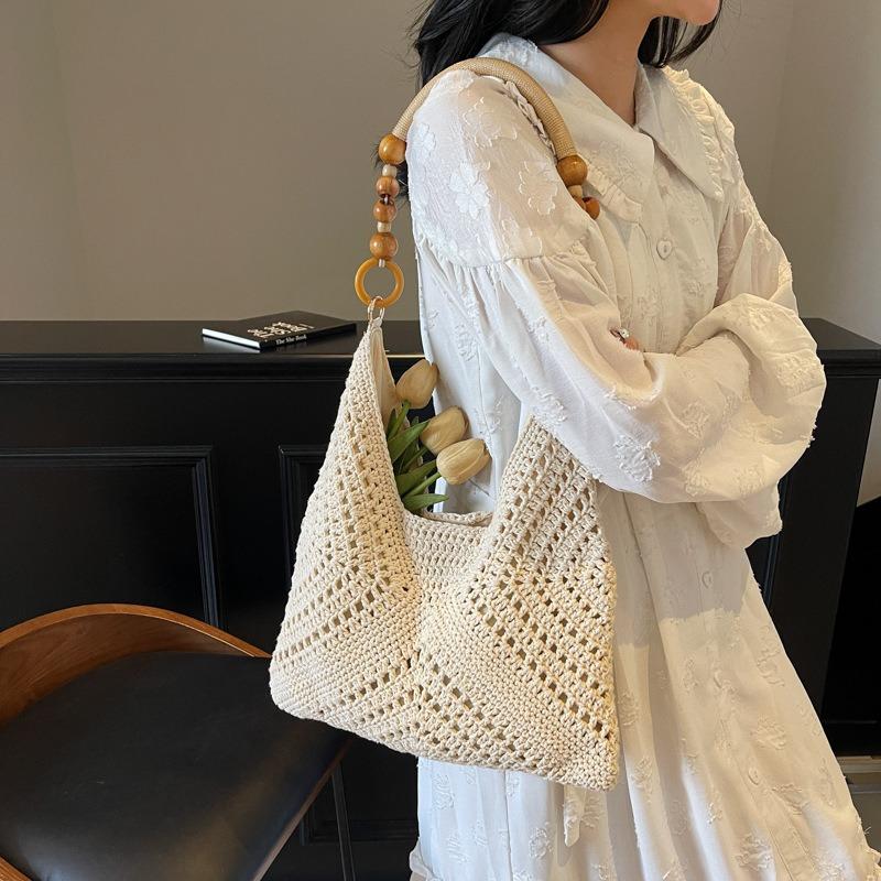 Seaside vacation beach bag women's new summer hollow bag commuting large capacity shoulder tote bag