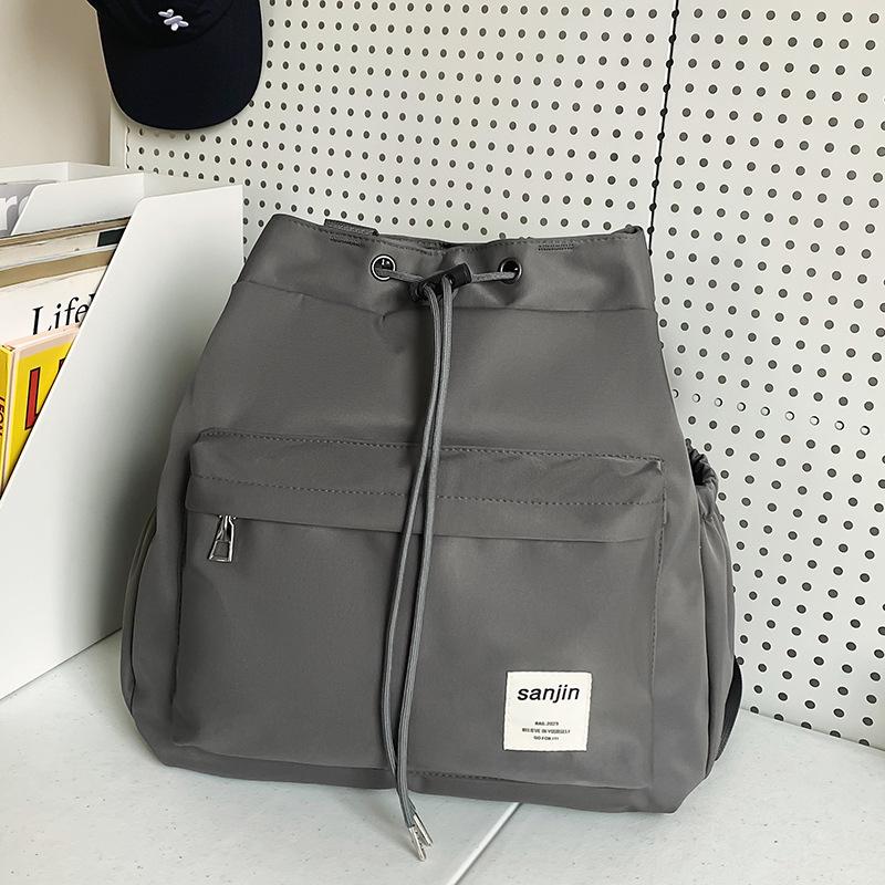 

Сумка-тоут женская 2024 новый большой вместительный рюкзак для поездок на работу ручной школьный портфель модный универсальный рюкзак для путешествий серый