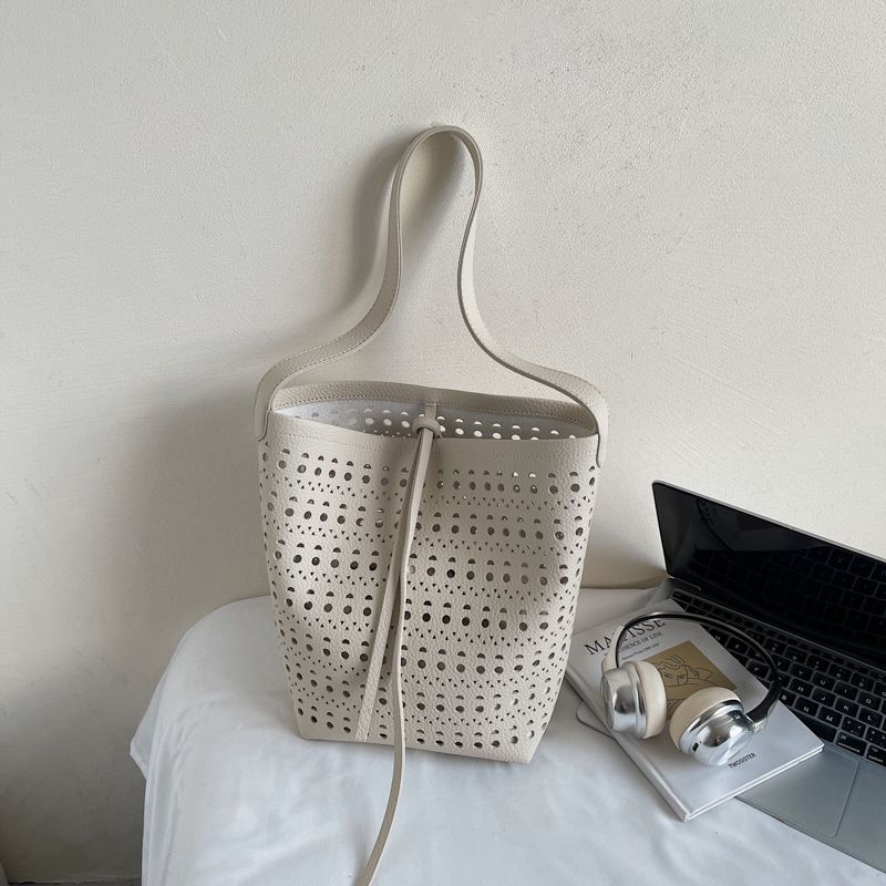 

Summer Popular Hollow Big Bag Women 2025 New Fashion Soft Leather Commuter Bucket Bag Simple Texture Underarm Bag Off-white without pendant