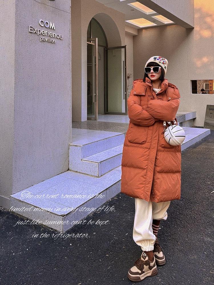 Anti-season autumn and winter new down jacket women's Chinese knot medium and long over the knee hooded waist thickened design sense niche