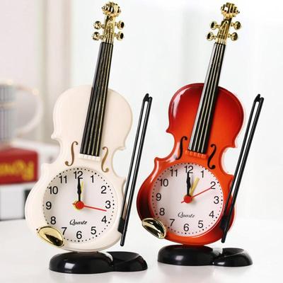 Reloj de escritorio creativo violín y despertador.