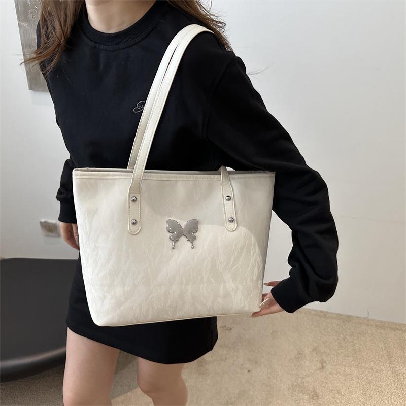 Die neue modische Pendler-Damentasche ist jetzt beliebt, Schmetterlingshalter, extra-große Tasche und Damen-Schultertasche mit großem Fassungsvermögen.