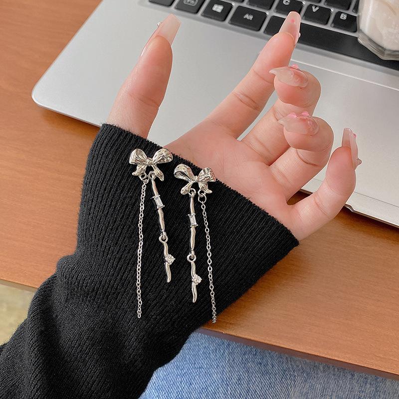 

Bow tassel long earrings women s high-end sense cold wind versatile earrings European and American exaggerated personalized earrings